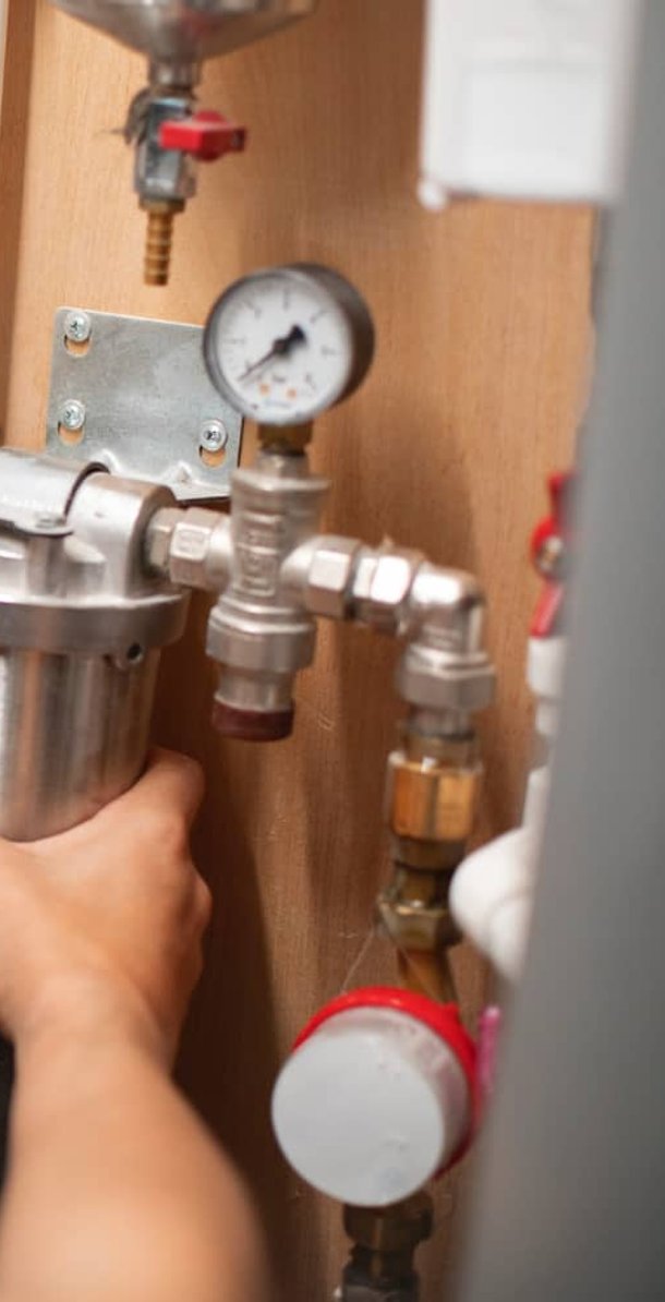 Licensed plumber completing plumbing repairs